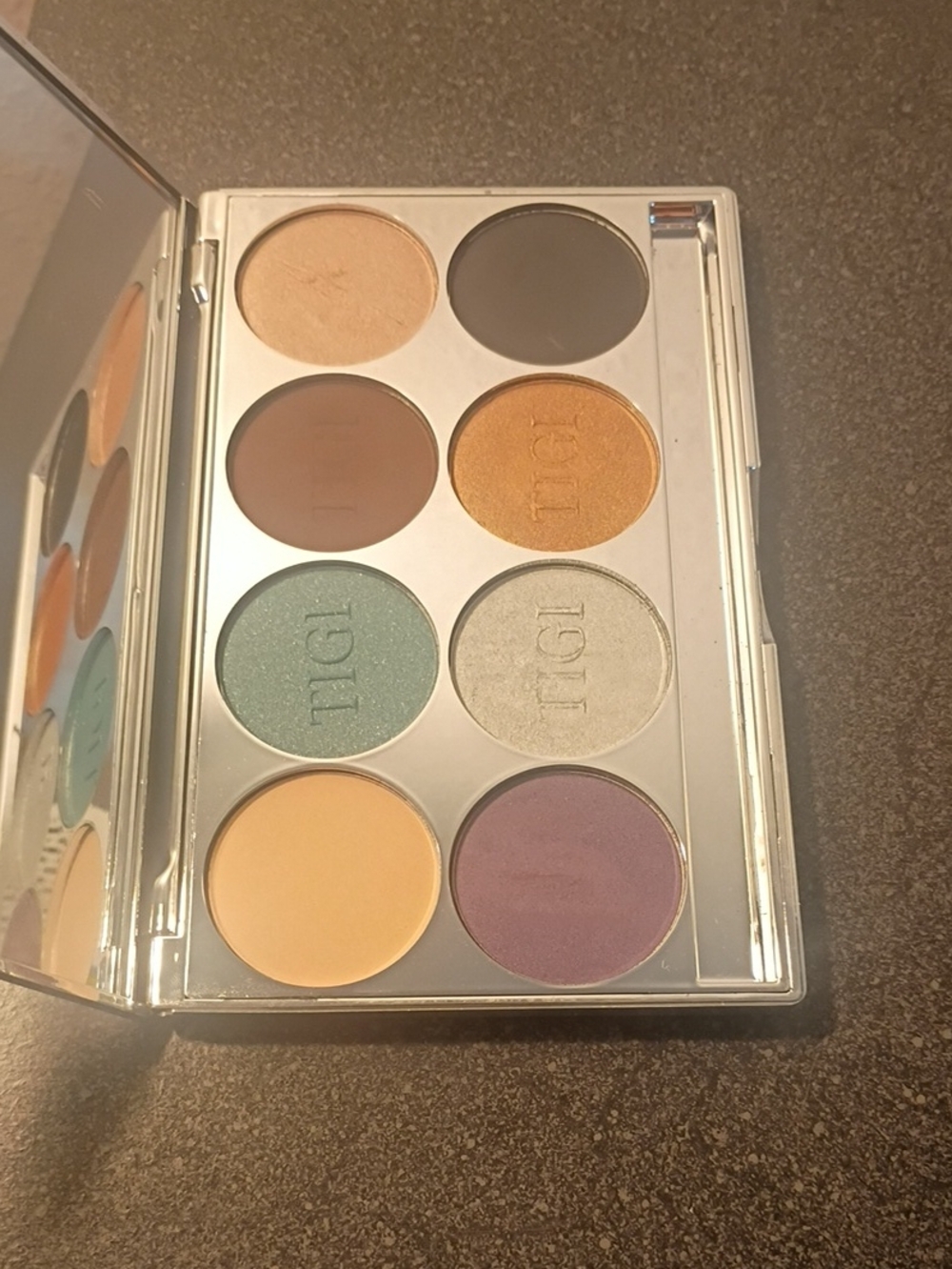 TIGI Eight-Shade Eyeshadow Palette in Green, Gold, Purple, Brown